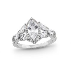 a white gold ring with three pear shaped diamonds on the sides and an intricate band