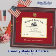 an award certificate is displayed in front of american flags