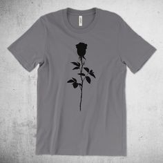 **Please note, Shirts orders are taking about two weeks to ship** Read the statement in the shop's FAQ for further information or learn more at the bottom of this product description. Black Rose | Rose Silhouette - Premium Cotton Tee This updated essential unisex jersey t shirt fits like a well-loved favorite, featuring a crew neck, short sleeves and designed with superior Airlume combed and ring-spun cotton that acts as the best blank canvas for printing. Features: Side-seamed. Retail fit. Unis Rose Silhouette, Rose Graphic, Rose Shirts, T Shirt Fits, Rose T Shirt, Shirt Fits, Jersey Design, Blank Canvas, Black Rose