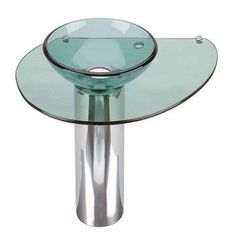 a round glass table with metal legs