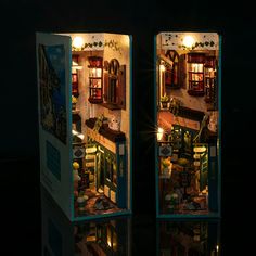 two small doll houses are shown in the dark