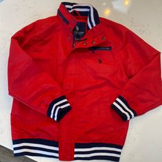 Us Polo Windbreaker. Size Child Large. Brand New Never Worn. $15 Red Outerwear For School In Fall, Red Casual Outerwear For School, Red Cotton School Outerwear, Red Cotton Outerwear For School, Red Winter Outerwear For School, Red Hooded Outerwear For School, Casual Red Outerwear For Cold Weather, Sporty Red Outerwear For School, Red Sporty Outerwear For School