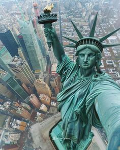 the statue of liberty in new york city, ny is shown from the top of the empire building