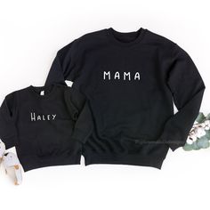 These matching sweatshirts are the perfect addition for any mama wanting to do matching mommy an daughter outfits or matching mom and son shirts. Make it extra special by adding your own custom names! *Grey sweatshirts are printed with black text ♥ABOUT OUR SWEATSHIRTS: Uptown Studio Designs uses a unisex adult Gildan brand sweatshirt. This unisex sweatshirt is preshrunk and has a classic fit. Consider ordering your regular size for a standard fit or size up if you want a roomier option. A sturd Family Matching Long Sleeve Sweatshirt With Name Print, Family Matching Graphic Print Sweatshirt, Family Matching Crew Neck Sweatshirt For Mother's Day, Mother's Day Family Matching Crew Neck Sweatshirt, Family Matching Long Sleeve Cotton Sweatshirt, Cotton Sweatshirt With Name Print, Customizable Family Matching Crew Neck Sweatshirt, Customizable Long Sleeve Family Matching Sweatshirt, Family Matching Sweatshirt For Mother's Day