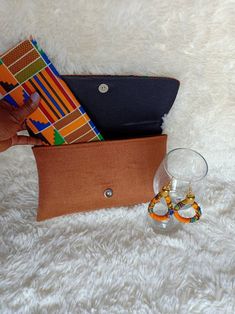 **African çlutch bags,African print bag,African leather purses, women purses. They are made out of kente and jute material They are fabulous way to bring taste to any outfit. Perfect christmas gift for her. **Comes with a matching wallet.and earrings.. Perfect gift for loved ones. For wholesale kindly message us. Ship via dhl express. Thank you for stopping by. African Bag, Mother Birthday, Gift For Her Birthday, Christmas Gift For Her, Coin Purses, Womens Purses, Printed Bags, Christmas Gifts For Her, Perfect Christmas Gifts