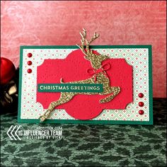 a christmas card with a reindeer on it