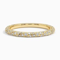 a yellow gold wedding band with diamonds