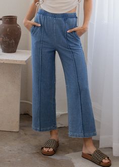 A wide length pant with pintuck detailing down the front to elongate the leg. Tailored to sit right above the ankle. Cut from an indigo twill. Details • Wide leg• Elastic waistband• Side and back pockets• Indigo dyedMeasurements based on size S• Waist: 29"• Inseam: "• Model is 5' 8". Wearing size XS. Fabric + Care • Indigo Twill - 55% Cotton / 40% Polyester / 5% Spandex• Machine wash in warm water with like colors. Do not bleach.• Tumble dry low.• Please note that indigo bleeds for the first few Relaxed Fit Washed Rigid Denim Pants, Mid-rise Acid Wash Cotton Pants, Non-stretch Medium Wash Denim Pants, Full-length Medium Wash Rigid Denim Pants, Comfy Jeans, Pre-washed Indigo Cotton Jeans, Pin Tucks, Ankle Length, Fabric Care