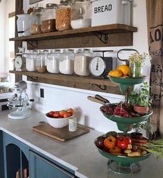 a kitchen counter topped with lots of different types of fruits and vegtables