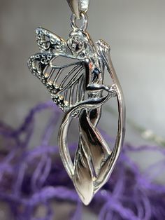 "Solid sterling silver on a silver chain -- Legends whisper that the fairies live within the wild woods among the ocean of lavender and blue daisies. Their roots buried deep within Celtic Britain where the lore of their existence seep across the land. Ruins hum to the rhythmic movement of their wings, traveling through the earth's veins- into the fairy pools of silken blue. Faeries are creatures of the forest and of nature. If they are treated with respect, they can and will help anyone. Faeries Blue Daisies, Fairy Pools, Jewelry Butterfly, Elven Jewelry, Fantasy Gifts, Wiccan Jewelry, Fairy Necklace, Irish Jewelry, Butterfly Fairy