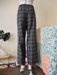 Timeless True Vintage pants from Pendleton, the iconic brand from Portland, Oregon! Made from soft woven virgin wool fabric with a subtle plaid check. Slightly cropped, darts on the front and on the back, two side pockets. Zip fly, fully lined. Note that the trousers are pinned so that they fit the manequin. Made in USA! Looks great with a pussybow silk blouse tucked in and ankle boots. ERA: 1980s BRAND: Pendleton COLOR: Grey, anthracite FABRIC: 100% virgin wool SIZE: Vintage size 12, fits best Fitted Wool Plaid Bottoms, Classic Plaid Bottoms For Winter, Classic Wide Leg Plaid Pants, Vintage Plaid Bottoms For Work, Vintage Plaid Pants For Work, Duffle Coat, Trousers Pants, Wool Trousers, Levi Jeans 501