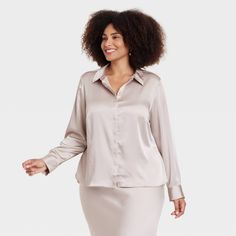 Upgrade your top collection with this Long-Sleeve Button-Down Satin Shirt from A New Day™. The button-down shirt is crafted from lightweight satin fabric to take you from day to night with effortless ease. It sports a collared neckline with a button-down front, buttoned long sleeves and a front placket for a smart look that's perfect for a variety of occasions. Pair it with just about any pair of pants for an array of outfit options. A New Day™: Style that goes wherever you do. Satin Button Down Shirt, Satin Shirt, Hem Style, Shop Blouses, Pair Of Pants, A New Day, Top Collection, Trending Shirts, Linen Women