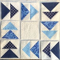 the blocks have blue and white quilts on each side, along with an arrow in the middle