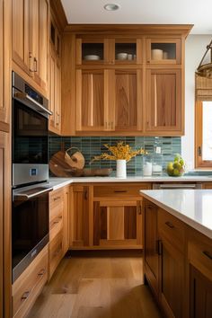 a kitchen with wooden cabinets and white counter tops