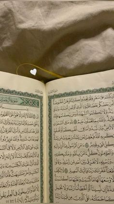 an open book with arabic writing on it