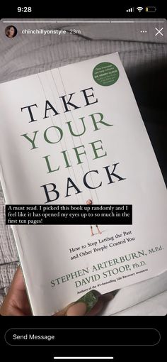 someone holding up a copy of the book take your life back