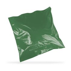 a green plastic bag with the words recycled by earth printed on it, and an empty white background