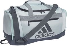 Keep your options open with this adidas duffel bag. Ready for whatever workout your trainer throws at you, this small-size bag lets you easily pack up your gear thanks to a roomy main compartment and zip pockets at the ends. A pad on the carry strap keeps things comfortable even when your bag feels heavy. Fit & Design: Dimensions: 20.5" x 11" x 11.75" Volume: 44.5 L Durable fabric Front zip pocket and end zip pockets Adjustable detachable shoulder strap with movable pad Dual carry handles with p Adidas Duffle Bag, Mtb Shoes, Brand Name Bags, Adidas Bags, Mens Travel Bag, Duffle Bags, Cycling Shoes, Athletic Sports, Gym Shoes