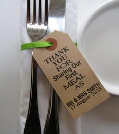 a white plate with a green ribbon around it and a tag that says thank you for sharing our meal