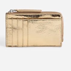 Our Leather Bag And Accessory Collection Is Cool, Modern And Quietly Luxe. This Streamlined Metallic Wallet Has Four Card Slots, A Large Front Slip Pocket And A Top Zip To Secure Loose Change And A Key Or Two. It's So Good, It's Essential. Leather. Zip Closure. Card Holder Pockets. 3"H X 5"W X 2"D. Luxury Gold Coin Purse With Card Slots, Classic Gold Bifold Coin Purse, Gold Leather Bags With Card Slots, Everyday Gold Leather Coin Purse, Elegant Gold Wallet With Coin Pocket, Gold Leather Wallet With Zipper Closure, Gold Bifold Wallet With Zipper Closure, Formal Gold Coin Purse With Card Slots, Gold Bifold Coin Purse For Everyday Use