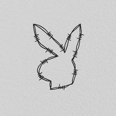 a black and white drawing of a rabbit's head with barbed wire on it