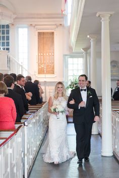 the bride and groom are walking down the aisle