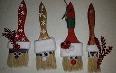 three christmas gnomes made out of toothbrush heads