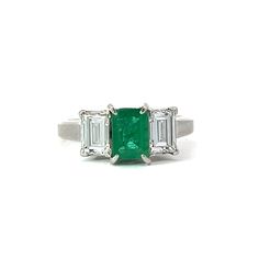 This Emerald, Diamond and Platinum Three Stone Ring features a stunning emerald stone set in a classic three stone design of diamonds and platinum. A perfect choice for an engagement ring that exudes sophisticated elegance and timeless style. Jewelry Style : RingMetal Type : PlatinumEmerald : 1 Emerald Cut Emerald, approximately 0.74 Ct.Diamonds : 2 Emerald Cut Diamonds, approximately 0.80 ctw Color G-H, Clarity VSApproximate Weight : 4.77 gramsStamped "074 080 PT900"Ring Size : 5estate piece Luxury Three Stone Diamond Emerald Ring, Elegant Three-stone Emerald Diamond Ring, Elegant Three Stone Emerald Diamond Ring, Luxury Emerald Ring With Three Stones And Radiant Cut, Luxury Three Stone Radiant Cut Emerald Ring, Elegant Three Stone Emerald Ring In White Gold, White Gold Emerald Diamond Ring With Three Stones, Platinum Emerald Three Stone Ring For Anniversary, Luxury Radiant Cut Three Stone Emerald Ring