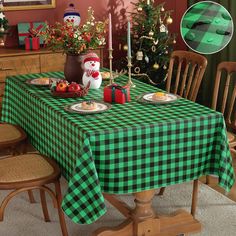 a christmas table with green and black checkered cloth