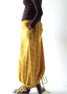 "Beautiful double layer fabric made of cotton/linen blend. High quality and stunning beauty. The fabric is unbleached and undyed, you can see the bark fibres in it! Subtle stripe pattern Drop-crotch style pants, baggy pants, tribal pants with a twist. 3 ways to wear. with drawstring on the hem. You can wear it with drawstring loose. Like a wide leg pants. Even look like A shape sweet skirt. You can also draw the string and get a balloon shape pants. Or...you can put the hem above your knee and g Cotton Harem Pants For Fall, Spring Harem Parachute Pants With Pockets, Fall Cotton Harem Pants, Spring Cotton Drop Crotch Harem Pants, Cotton Harem Pants For Fall Festival, Cotton Harem Parachute Pants With Pockets, Bohemian Harem Pants Ankle-length For Fall, Casual Spring Harem Parachute Pants, Bohemian Ankle-length Harem Pants For Fall