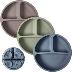 three different colored plates with lids on each one and two smaller ones in the middle