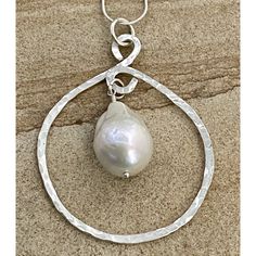 Looking to radiate confidence and sunlight in handcrafted artisan jewelry? You’re in luck — this piece frames a large baroque freshwater pearl for a powerful pendant that truly catches the light. Centered in hammered sterling silver, this piece is impossible to look away from! 2"x2.5"x.25" hammered sterling .875"x.675" white baroque freshwater pearl 20" sterling chain includes adjustable leather cord (18"-20") Pearl Drop Pendant, Citrine Earrings Studs, Art Jewelry Design, Radiate Confidence, Metal Smithing, Amethyst Studs, Turquoise Stud Earrings, Fine Art Jewelry, Baroque Pearl Necklace