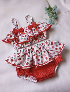 This cute little  outfit is perfect for your birthday photos.Size  12 months. Material cotton Cute Ruffled Sets For Playtime, Cute Ruffled Sets For Playwear, Cute Ruffled Playwear Sets, Cute Pink Strawberry Print Sets, Cute Ruffled Sets For Spring, Cute Strawberry Print Sets For Spring, Playful Ruffled Sets For Playtime, Red Summer Birthday Sets, Cute Cotton Diaper Cover With Ruffles