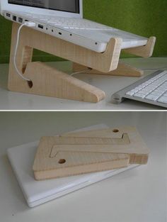 the laptop stand is made out of wood and has three pieces of paper attached to it