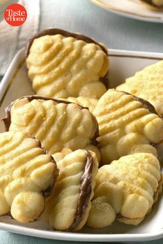 some cookies are sitting on a white plate