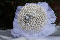 a bridal bouquet with pearls and diaper