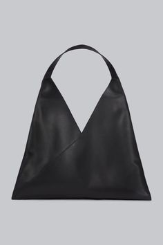 The oversized soft-touch Leather Tote Bag is a timeless essential for the modern wardrobe. Crafted from 100% cow leather, this luxurious tote seamlessly combines style and functionality. With its sleek design and embossed logo, it exudes understated sophistication while offering ample space for all your essentials. Whether you're heading to the office, beach, or out for the evening, this tote ensures you're always prepared in style. Key features include: 100% premium cow leather for a soft-touch Always Prepared, Oversized Tote Bag, Oversized Tote, Half Zip Sweatshirt, Modern Wardrobe, Embossed Logo, Leather Tote Bag, Cow Leather, Stylish Design