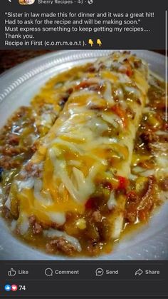 a white plate topped with meat covered in cheese