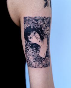 a woman's arm with a tattoo on it