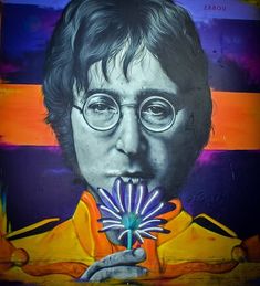 a painting of john lennon holding a flower in his mouth