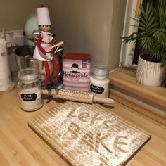 a wooden counter topped with lots of baking supplies