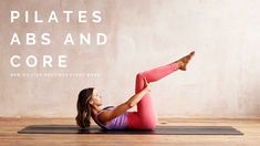 a woman is doing yoga on a mat with the words pilates, abs and core