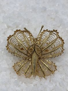 Just gorgeous: a 14K gold butterfly brooch/ pendant. The Pendant, circa 1950s, weighs 5.92 grams. Elegant Butterfly Shaped Filigree Jewelry, Elegant Butterfly Filigree Jewelry, Butterfly Filigree Jewelry For Weddings, Butterfly Filigree Wedding Jewelry, Elegant Gold Butterfly Ring For Formal Occasions, Wedding Butterfly Filigree Jewelry, Elegant Yellow Gold Butterfly Ring, Gold Butterfly Brooch As Gift, Gold Butterfly Brooches For Collectors