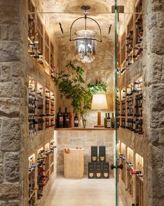 the wine cellar is filled with many bottles