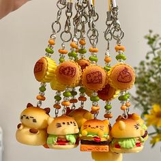 a bunch of small toys hanging from a chain