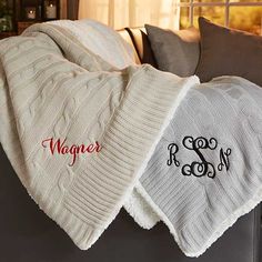 two blankets with monogrammed names on them