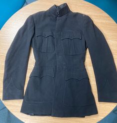 A tailor made blues (No. 1s) coat for a British Army Officer. All insignia have been removed. No. 1 Dress, or "dress blues", is a ceremonial uniform, worn on only the most formal of occasions and by senior staff officers, aides to the Royal Family, and to the personal staff of senior officers in command. It is not generally issued to all units, with the khaki No. 2 Dress functioning as the main parade uniform. Formal Fitted Blazer With Epaulettes, Formal Uniform Style Outerwear With Buttons, Classic Long Sleeve Formal Uniforms, Formal Outerwear With Buttons, Classic Formal Outerwear With Epaulettes, Vintage Navy Outerwear For Formal Events, Formal Fitted Uniform With Long Sleeves, Formal Fitted Long Sleeve Uniform, Formal Long Sleeve Uniform