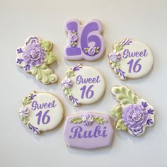 decorated cookies are arranged in the shape of flowers and numbers for sweet sixteen birthdays