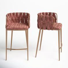 two pink chairs sitting next to each other