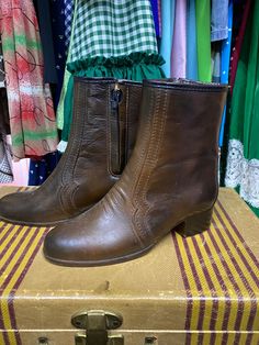 There's nothing like vintage leather boots! These size 6 brown leather boots are in amazing shape, almost as if they've never been worn! They measure 9 1/2 inches heel to toe, 7 1/2 inches from the top of the boot to the base and 3 inches across in the toe(wide). These boots are American made, leather and have a fleece lining on the inside! They even have a vintage tag inside! These come up a little less than mid calf; slightly longer than an ankle boot. These would be amazing with a dress or vi Retro Ankle Boots For Fall, Retro Leather Winter Boots, Vintage Pointed Toe Mid-calf Boots For Fall, Retro Moto Boots With Round Toe For Fall, Retro Ankle-high Leather Heeled Boots, Retro High Ankle Boots For Fall, Retro Leather Boots For Fall, Retro Ankle Boots For Winter, Retro Ankle-high Boots For Fall